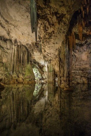 Huge stalactites and underground lake, stalactite cave Grotta di Nettuno, Neptune Grotto, Capo Caccia, near Alghero, Sardinia, Italy