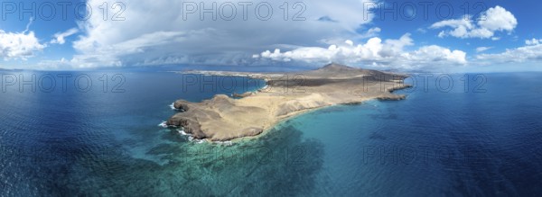 Headland and blue sea, coastal landscape, arid landscape of Los Ajaches Natural Park, aerial view, Lanzarote, Canary Islands, Spain