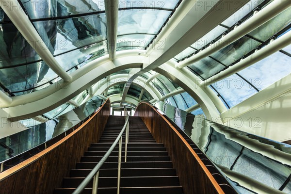 Spectacular double spiral staircase from ground floor to roof terrace, offering breathtaking views over the Maas and Hotel New York, FENIX, museum about migration, in a historic warehouse in Katendrecht, Rotterdam, the Netherlands