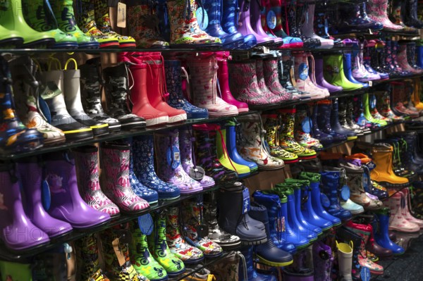 Colourful rubber boots in a shoe store, Bavaria, Germany