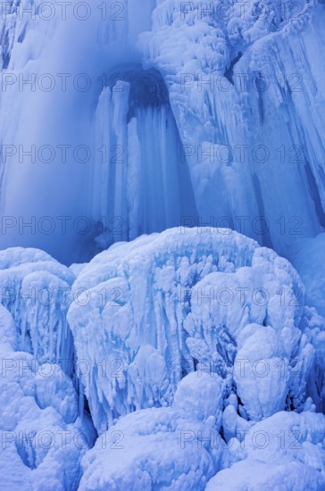 Urach waterfall full of bizarre ice formations frozen at winter temperatures, Bad Urach, Swabian Jura, Baden-Württemberg, Germany