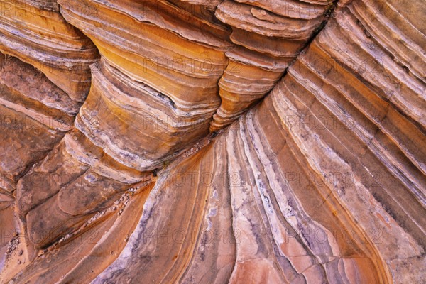 Close-up image of layered red rock formations showing vivid stripes and textures. Perfect for geological studies and nature-related designs