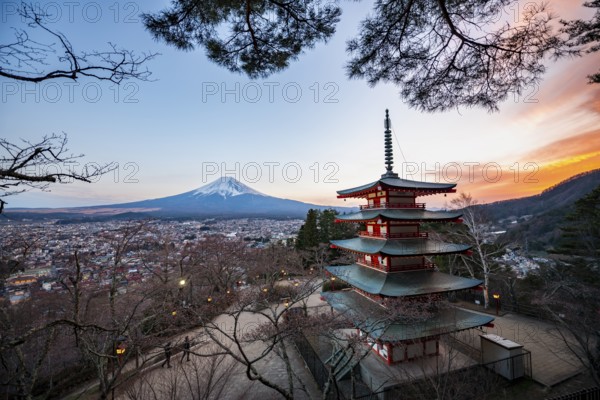 Five-story pagoda of a Shinto Shrine, Chureito Pagoda, with views of Fujiyoshida City and Mount Fuji volcano at sunset, Arakura Fuji Sengen Shrine, Arakurayama Sengen Park, Yamanashi Prefecture, Japan