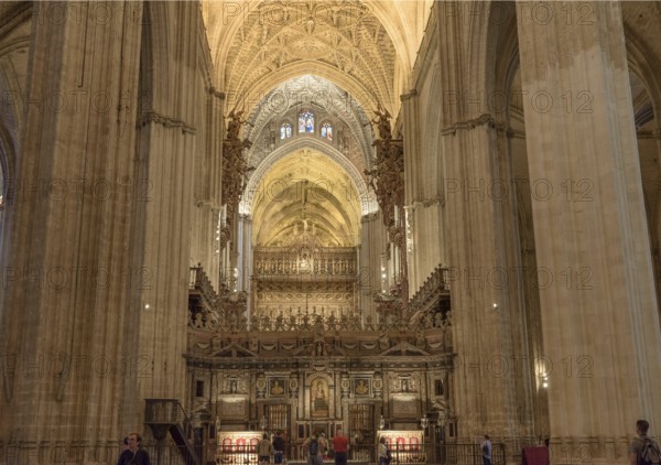 Impressive organ and architecture with ornate vaults in a church, Seville, Andalusia, Spain