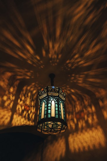 From below colorful lamp with glowing lights in dark room