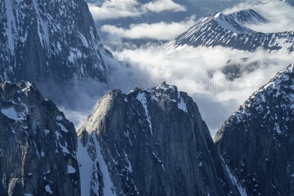 Snow and ice, epic mountains with steep cliffs, aerial view, Alaska Range, Denali National Park, Alaska, USA