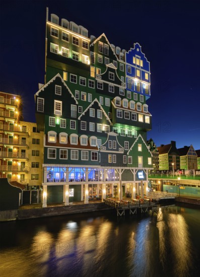 ZAANDAM, NETHERLANDS, MAY 8, 2017: Inntel Hotel in Zaandam illuminated at night. Design of 12-storey tall building opened in 2009 is the result of stacking a series of traditional Dutch houses