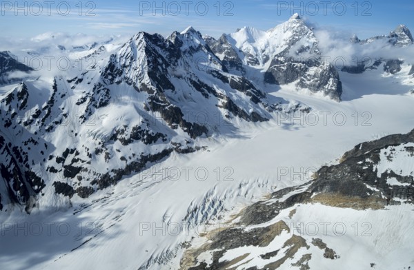 Snow and ice, epic mountains with glaciers, aerial view, Alaska Range, Denali National Park, Alaska, USA