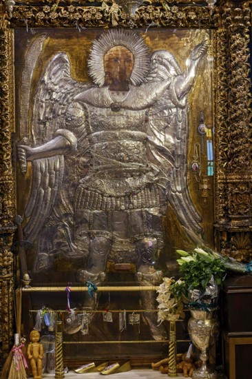 Archangel Michael, large angel statue in a gilded frame decorated with candles and flowers, Holy Week, Bay of Panormitis, Panormitis Monastery, Symi, Dodecanese, Greek Islands, Greece