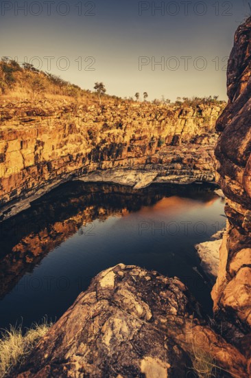 Bell Gorge waterfall, a body of water in north-west Australia in the Kimberley. Sunrise in the outback, Australia