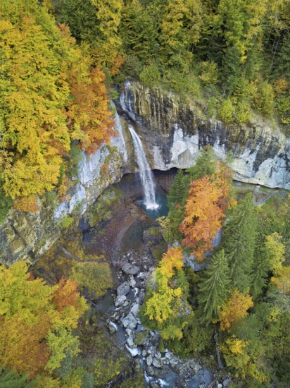 Aerial view of Berglistüber waterfall in autumn-colored surroundings, Linthal, Klausenpass, Canton of Glarus, Switzerland