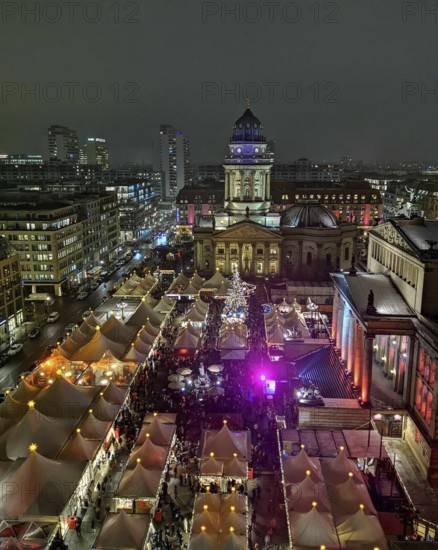 View from above of lively Christmas market atmosphere at night on the Gendarmenmarkt, Berlin