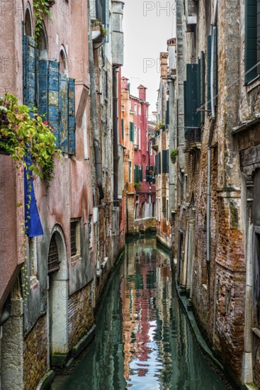 Canal with historical architecture, gondola, old town, water, tourism, city trip, Venice, Italy