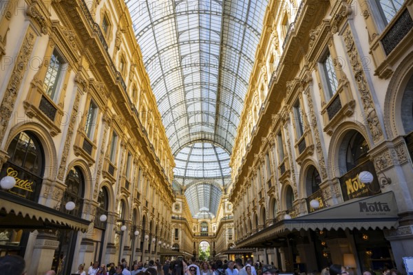 View of the Galleria Vittorio Emanuele with its many luxury shops in Milan on a sunny day, Milan, Italy