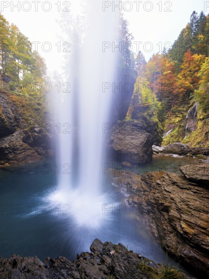 Waterfall mountain list in autumn-colored surroundings, Linthal, Klausenpass, Canton of Glarus, Switzerland