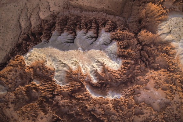 A striking aerial shot of the distinctive geological formations in Goblin Valley State Park, Utah, showcasing erosion's artistry on sandstone