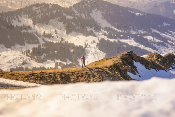 Person enjoying the view of an impressive, snow-covered mountain landscape, Hochgrat Mountains, Allgäu Alps, Oberreute, Germany