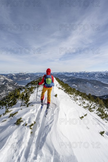 Ski tourer at the summit of Simetsberg, mountain panorama, Estergebirge, Bavarian Prealps, Bavaria Germany
