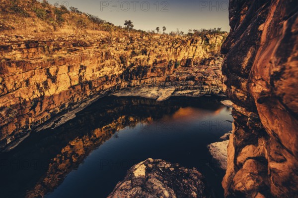 Bell Gorge waterfall, a body of water in north-west Australia in the Kimberley. Sunrise in the outback, Australia