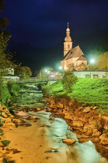 Church St. Sebastian in Ramsau at night, Ramsauer Ache River, autumn, Idyllic village, Berchtesgadener Land, Bavaria, Germany