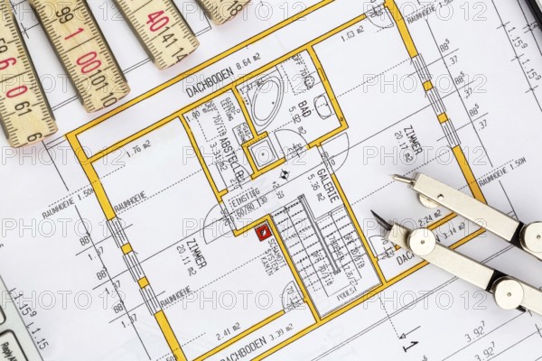 An architect's plan for the construction of a new home. Symbolic photo for financing and planning a new house, single-family house studio shot