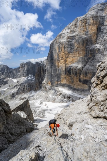 Climbers on the Via Ferrata Brentari via ferrata, spectacular mountain landscape with steep cliffs, Brenta Mountains, Parco Naturale Brenta-Adamello, Trentino, Italy