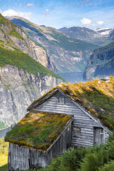 Blomberg Gård, historic mountain farm on steep mountainside, Geirangerfjord, near Geiranger, Møre og Romsdal, Norway