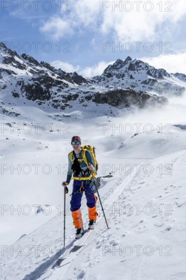 Ski tourers on the Bündner Haute Route, Albula Alps in winter, Rhaetian Alps, Graubünden, Eastern Switzerland, Switzerland