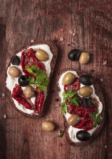 Breakfast, sandwiches, with cream cheese, olives, top view