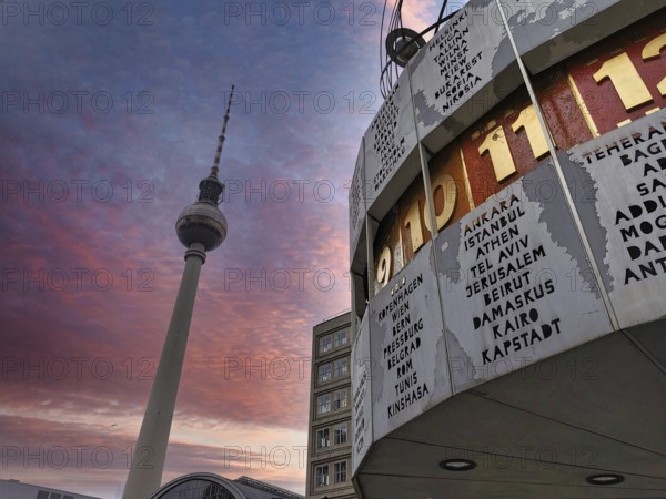 Atmospheric sunset with pink sky over Berlin World Clock and Berlin TV Tower, Alexanderplatz, Alex, Mitte, Berlin