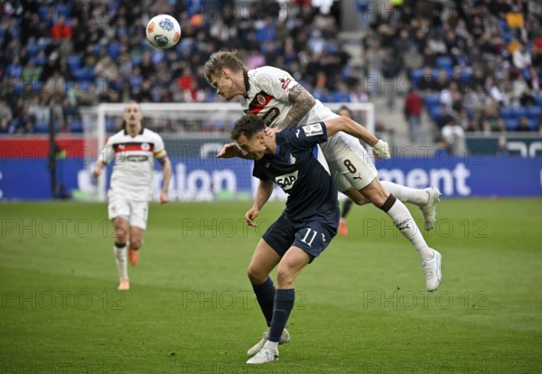 Duel, action Fisnik Asllani TSG 1899 Hoffenheim (11) against Eric Smith FC St. Pauli (08) Soccer Bundesliga, PreZero Arena, Sinsheim, Baden-Württemberg, Germany