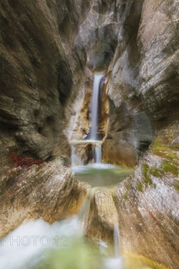 Waterfall with zoom effect Heckenbach waterfall, The dripping eye of nature, Kochel am See, Bavaria, Germany