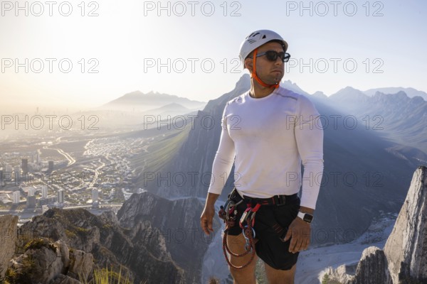 A man confidently practices mountaineering and rappelling at Eagleâ€™s Nest in Monterrey, Mexico, capturing the adventurous spirit and stunning landscape of the region