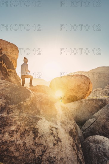 Woman hiking at sunrise in Joshua Tree National Park