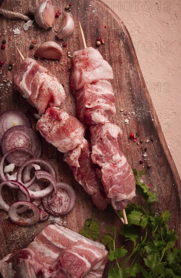 Raw pork meat, on wooden sticks, pickled kebab, with spices, top view, no people