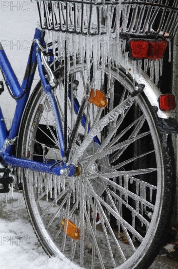 Bicycle icy due to freezing rain, icicles, detailed view