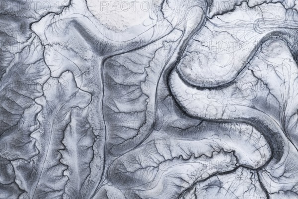 A captivating aerial shot of the unique and intricate natural patterns at Moonscape Overlook in Utah, resembling a lunar landscape