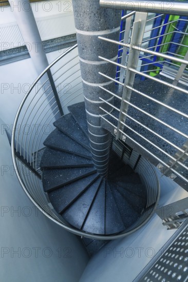 Modern metal spiral staircase in a bright interior, Sindelfingen, Böblingen district, Germany