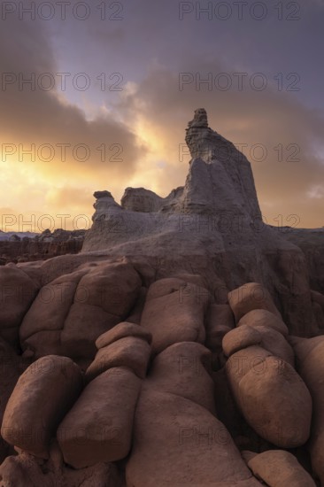 Stunning sandstone formations in Goblin Valley State Park, Utah, under a dramatic sky. The unique rock shapes capture the essence of the desert landscape
