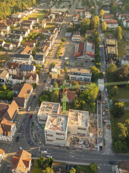 Aerial view of a city centre with a construction site in the foreground and many buildings all around, Nagold, Black Forest, Germany