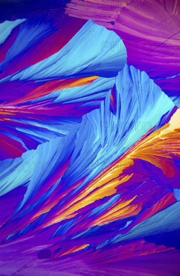 Microscopic image showcasing vivid Adipic acid, crystals in stunning shades of blue, purple, and red