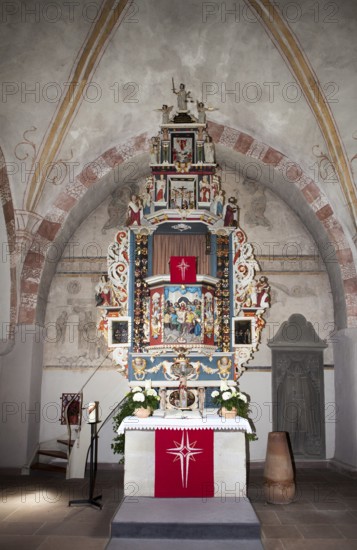 St. Michael Baroque pulpit altar, 1634, sacrament with 13 disciples, Kirchbrak, district of Holzminden, Weserbergland, Lower Saxony, Germany. The relief carved by wood shows the birth, crucifixion and the ascension of Christ and the sacrament with thirteenth disciples.