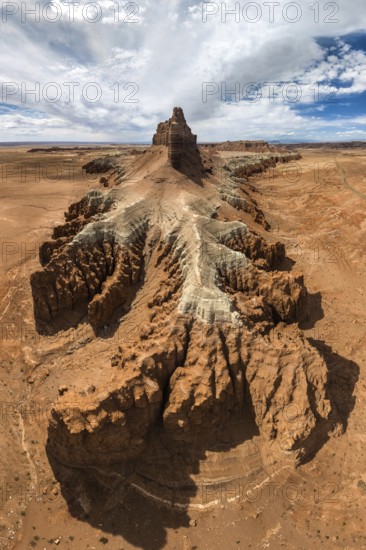 Captivating aerial view showcasing the intricate and barren landscapes of Goblin Valley State Park in Utah, highlighting the unique geological formations under a expansive blue sky