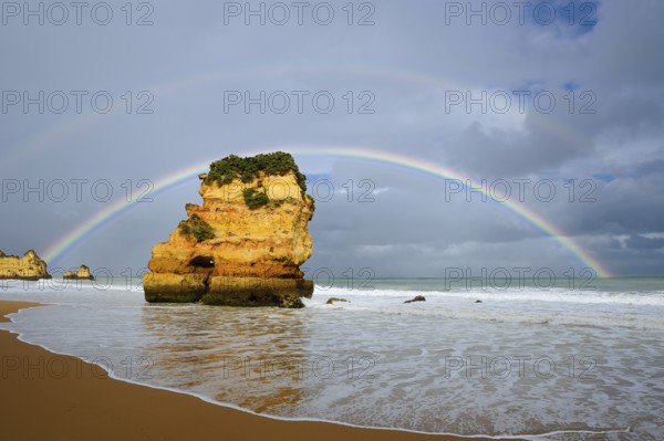 Rocks on beach with rainbow, Praia Dona Ana, Lagos, Algarve, Portugal