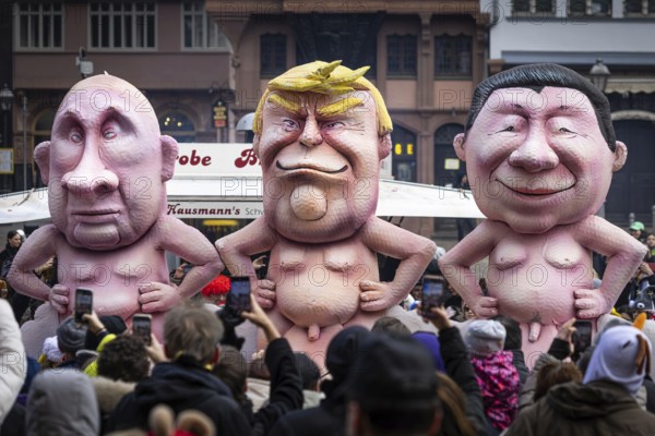 The Frankfurt carnival procession moves across the Römerberg in Frankfurt am Main on 15 February 2026. A float shows Presidents Vladimir Putin (left, Russia), Donald Trump (centre, USA) and Xi Jinping (right, China), Römerberg, Frankfurt am Main, Hesse, Germany