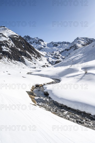 Funtauna Valley with mountain stream and snow in winter, Graubünden Haute Route, Albula Alps, Rhaetian Alps, Graubünden, Switzerland