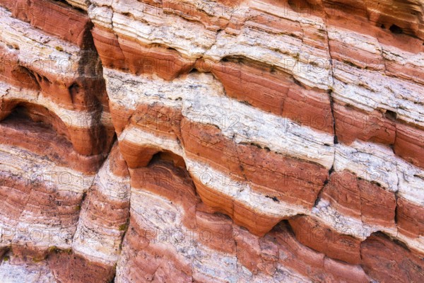 This image captures the intricate patterns of red rock strata, highlighting varying tones and erosion-carved lines. Perfect for natural textures or geological studies