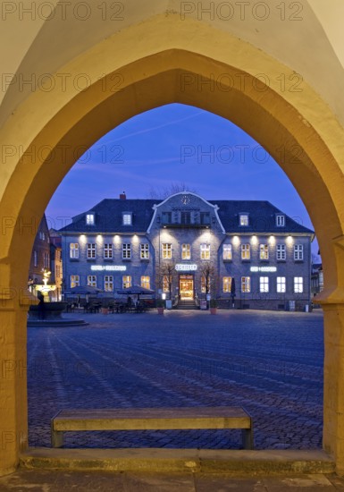 View from the open hall of the late Gothic town hall in Goslar in the evening onto the market square with the Kaiserringhaus, UNESCO World Heritage Site, Lower Saxony, Germany