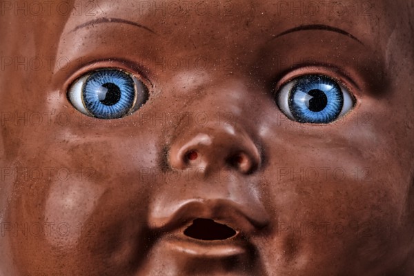 Old doll, demonic face
