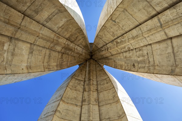 Symmetrical view of the concrete arches of a modern monument, The National Independence Monument in Algiers Algeria